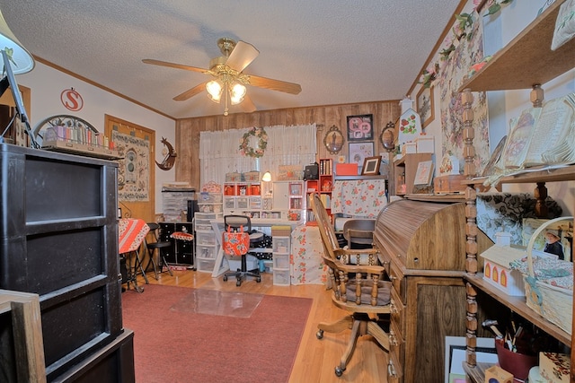 2105 Carters Ferry Rd, E Road, Milam, TX 75959 - home office with a textured ceiling, a ceiling fan, crown molding, and wood finished floors