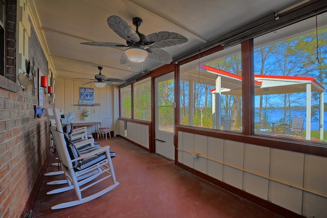 2105 Carters Ferry Rd, E Road, Milam, TX 75959 - sunroom / solarium featuring a water view, a ceiling fan, and finished concrete floors