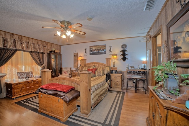 2105 Carters Ferry Rd, E Road, Milam, TX 75959 - bedroom featuring visible vents, light wood-style floors, and a textured ceiling