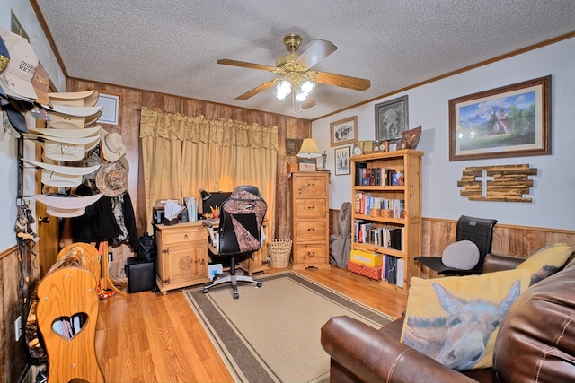 2105 Carters Ferry Rd, E Road, Milam, TX 75959 - office area featuring a textured ceiling, ornamental molding, a ceiling fan, wood finished floors, and wood walls