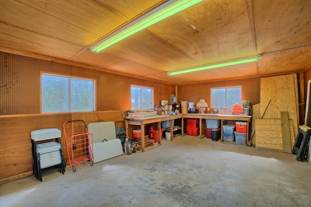 2105 Carters Ferry Rd, E Road, Milam, TX 75959 - miscellaneous room featuring unfinished concrete flooring, wooden ceiling, and a workshop area
