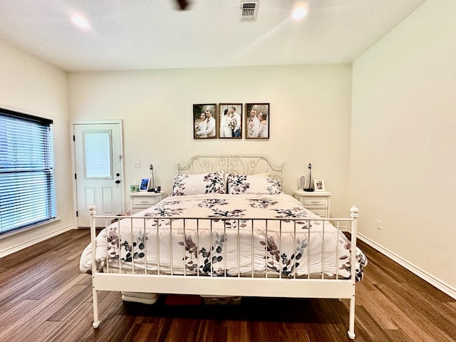4815 Fm 2827, Warren, TX 77664 - bedroom with dark wood finished floors, baseboards, and recessed lighting
