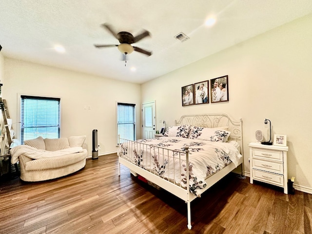 4815 Fm 2827, Warren, TX 77664 - bedroom with wood finished floors, multiple windows, recessed lighting, and baseboards