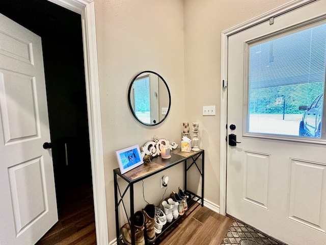 4815 Fm 2827, Warren, TX 77664 - doorway with dark wood-style flooring and baseboards