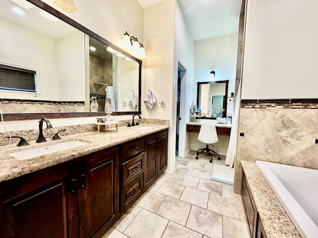 4815 Fm 2827, Warren, TX 77664 - full bathroom featuring a bath, double vanity, a tile shower, tile patterned floors, and tile walls