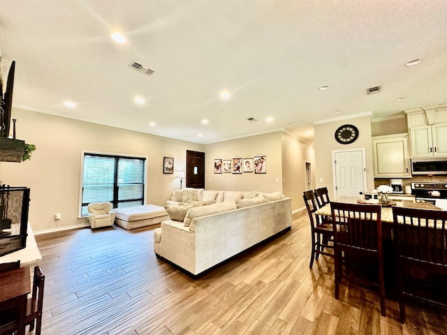 4815 Fm 2827, Warren, TX 77664 - living room featuring wood finished floors, crown molding, recessed lighting, and baseboards