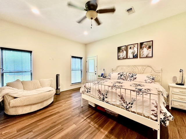 4815 Fm 2827, Warren, TX 77664 - bedroom with multiple windows, wood finished floors, recessed lighting, a ceiling fan, and baseboards