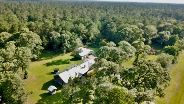 4815 Fm 2827, Warren, TX 77664 - aerial view of property and surrounding area featuring a heavily wooded area