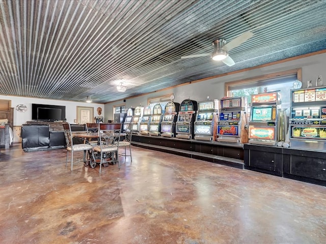 interior space with ceiling fan and concrete floors