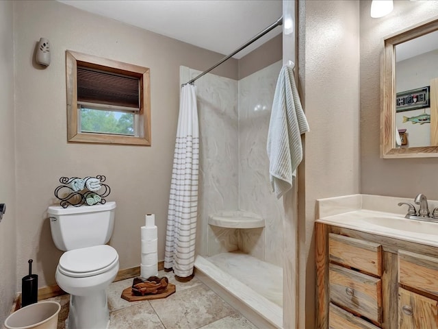 bathroom featuring a shower with shower curtain, vanity, toilet, and tile patterned floors