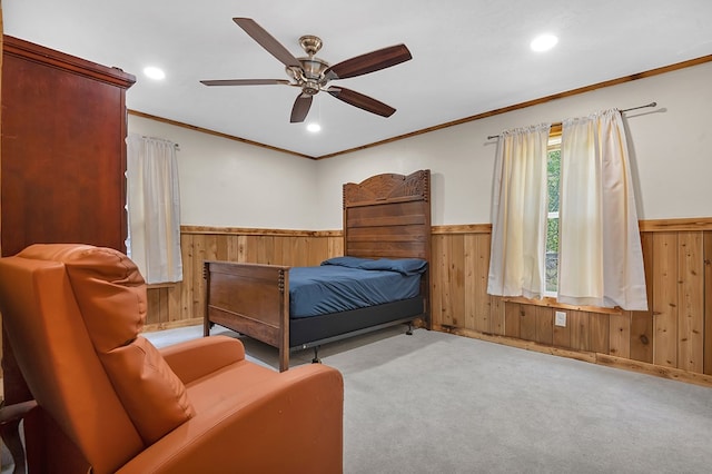 carpeted bedroom featuring wooden walls, recessed lighting, and wainscoting