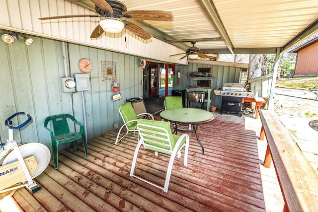 deck featuring outdoor dining area and ceiling fan