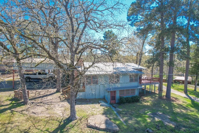 exterior space with a lawn and a deck