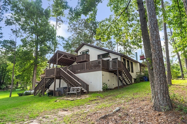 130 Boxwood Ln, Brookeland, TX 75931 - back of house with stairs, a deck, and a lawn