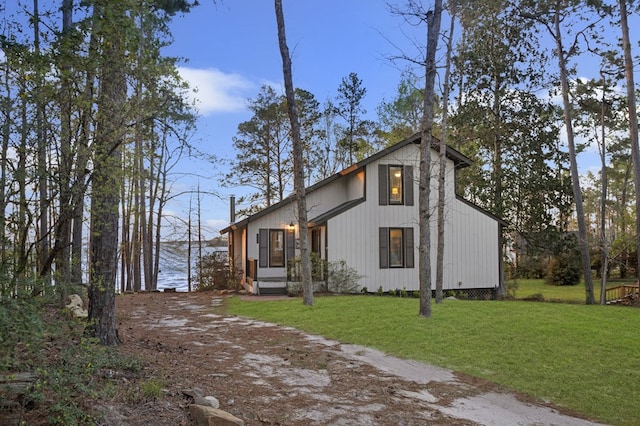130 Boxwood Ln, Brookeland, TX 75931 - view of property exterior with a yard