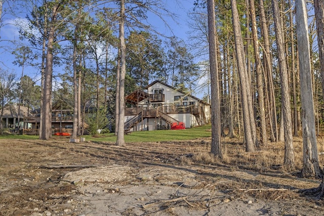 130 Boxwood Ln, Brookeland, TX 75931 - view of yard with stairs and a deck