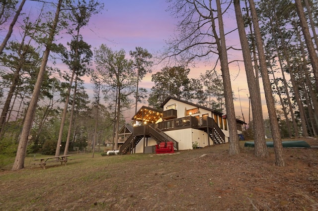 130 Boxwood Ln, Brookeland, TX 75931 - rear view of property with stairs and a wooden deck