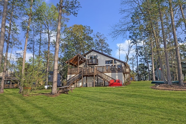 130 Boxwood Ln, Brookeland, TX 75931 - back of house featuring stairway, a deck, and a lawn