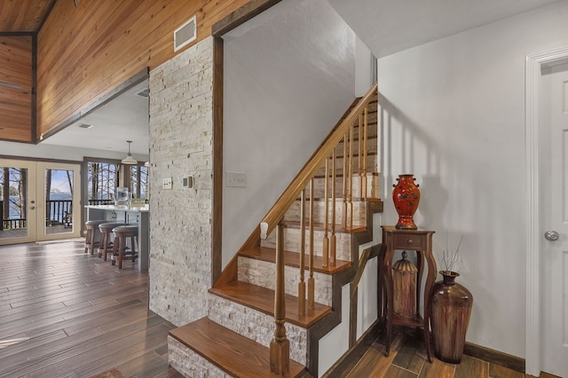 130 Boxwood Ln, Brookeland, TX 75931 - stairs with hardwood / wood-style floors and french doors