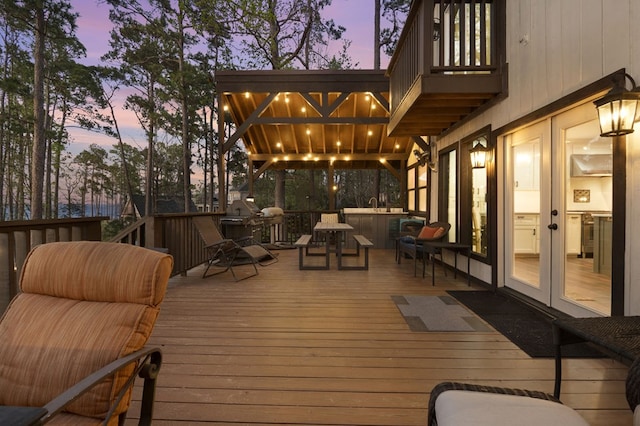130 Boxwood Ln, Brookeland, TX 75931 - deck at dusk with french doors