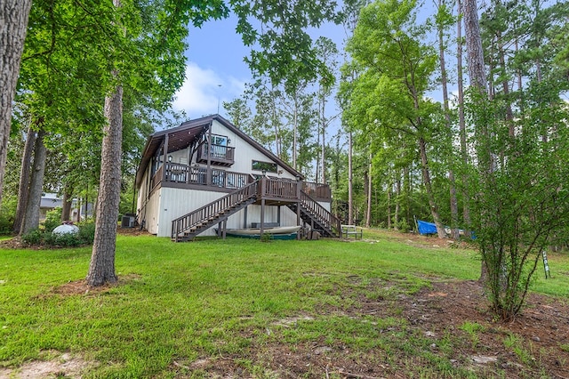 130 Boxwood Ln, Brookeland, TX 75931 - back of property featuring stairs, a yard, and a deck