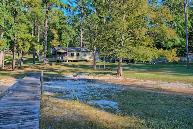 view of home's community featuring a lawn