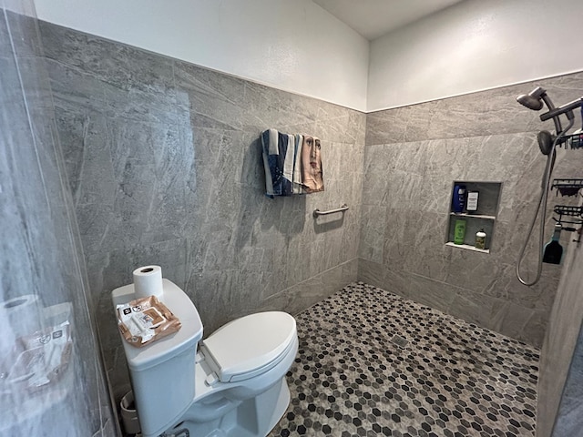 full bathroom with toilet and tiled shower