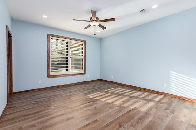 spare room with ceiling fan and light hardwood / wood-style floors