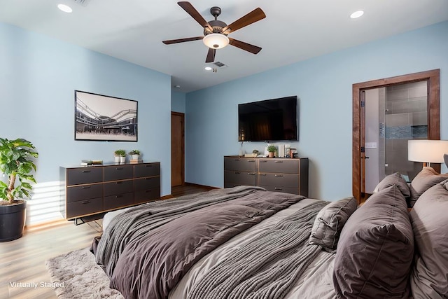 bedroom with ceiling fan and hardwood / wood-style floors