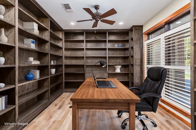 office with ceiling fan and light hardwood / wood-style floors