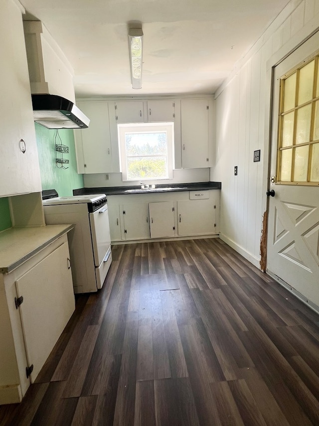 kitchen featuring dark hardwood / wood-style flooring, white stove, white cabinetry, and exhaust hood