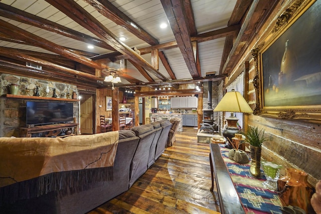 living room with wooden walls, vaulted ceiling with beams, ceiling fan, wood-type flooring, and wood ceiling