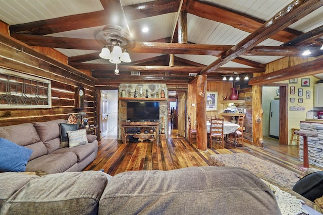 living room with hardwood / wood-style floors, lofted ceiling with beams, ceiling fan, and wooden walls