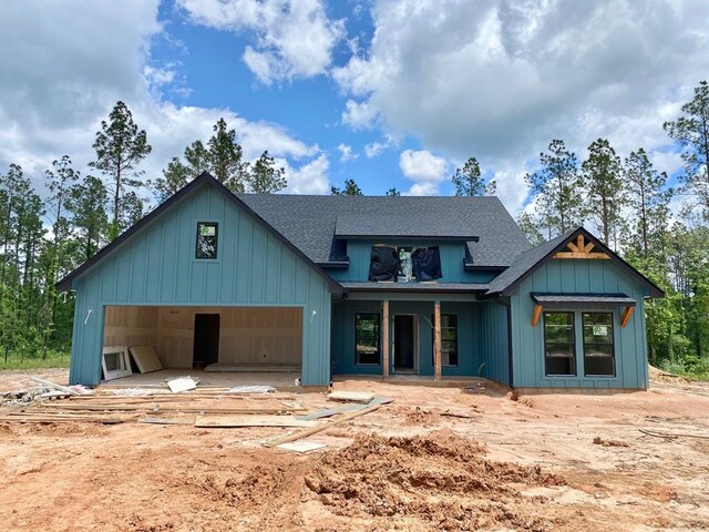 1555 Fm 844, Huntington, TX 75949 - view of front of home featuring a shingled roof and board and batten siding