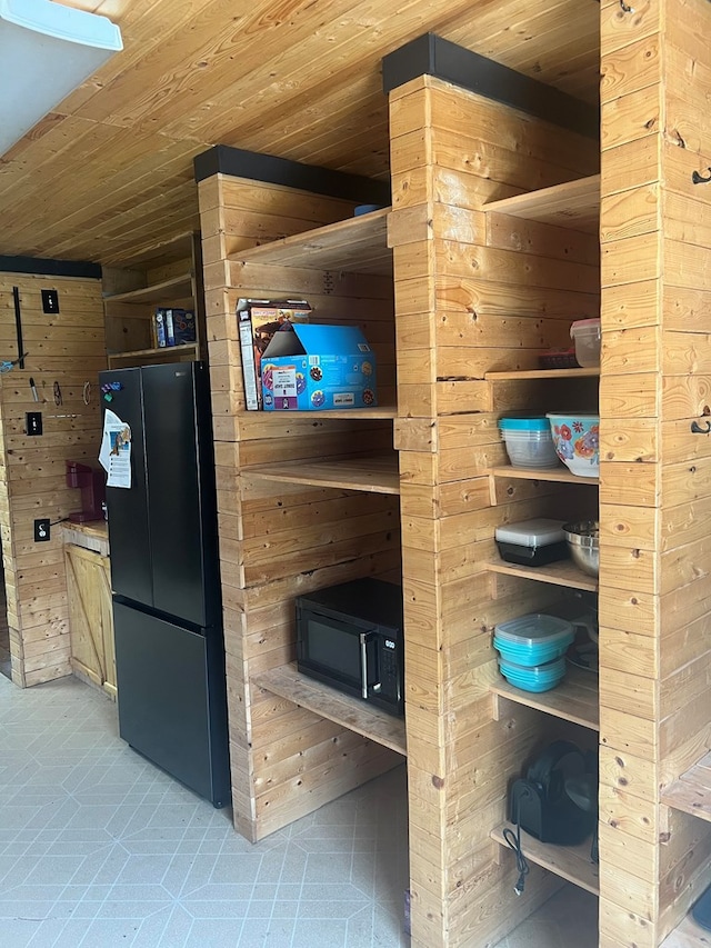 1026 Berry Rd, Lufkin, TX 75904 - sauna with wood ceiling, wood walls, and tile patterned flooring