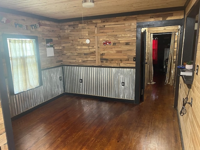 1026 Berry Rd, Lufkin, TX 75904 - empty room with dark wood-style flooring, wooden walls, and wood ceiling