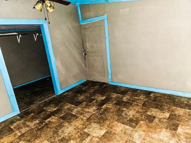 1026 Berry Rd, Lufkin, TX 75904 - unfurnished bedroom featuring stone finish floors and baseboards