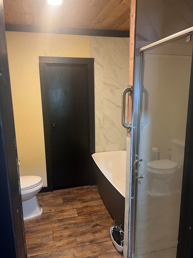 bathroom with hardwood / wood-style floors, toilet, wooden ceiling, and walk in shower