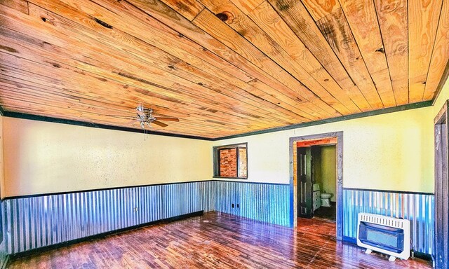 unfurnished room with heating unit, ceiling fan, hardwood / wood-style floors, and wood ceiling