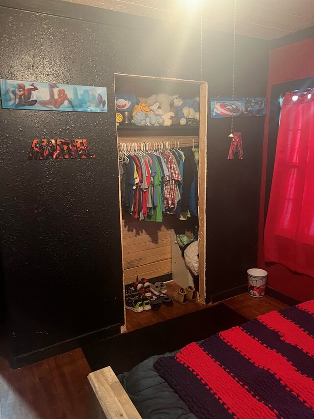 bedroom featuring a closet and wood-type flooring