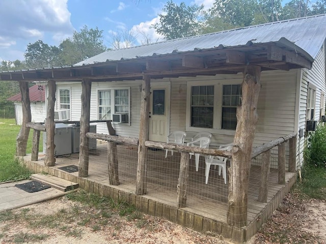1026 Berry Rd, Lufkin, TX 75904 - view of front facade with a metal roof and cooling unit