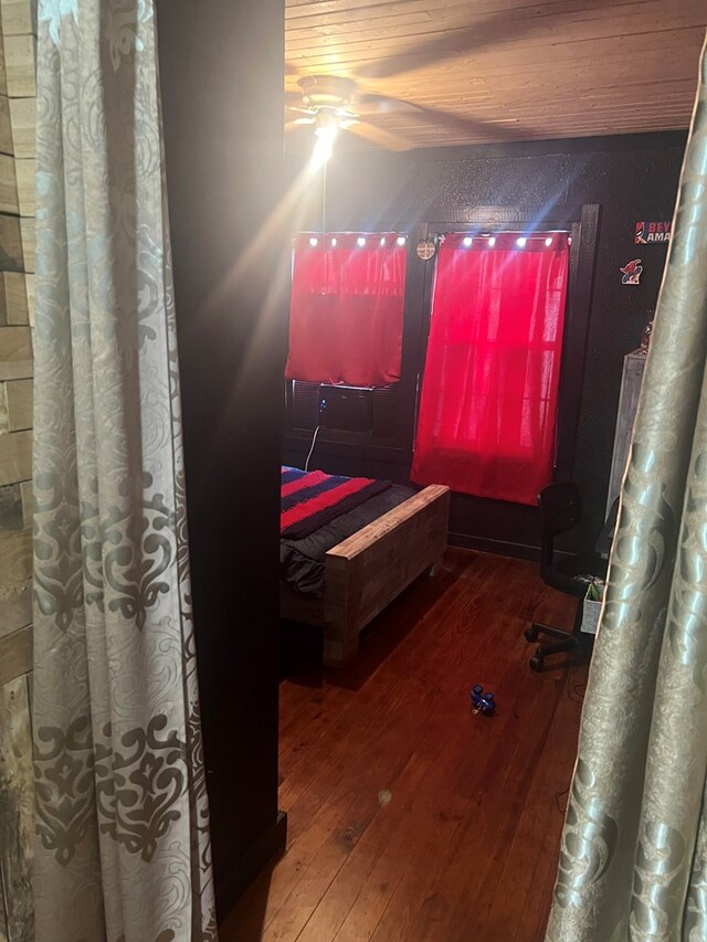 bedroom featuring hardwood / wood-style flooring, ceiling fan, and wooden ceiling