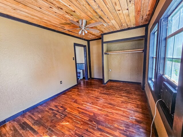 unfurnished bedroom with ceiling fan, wood ceiling, dark wood-type flooring, and a closet