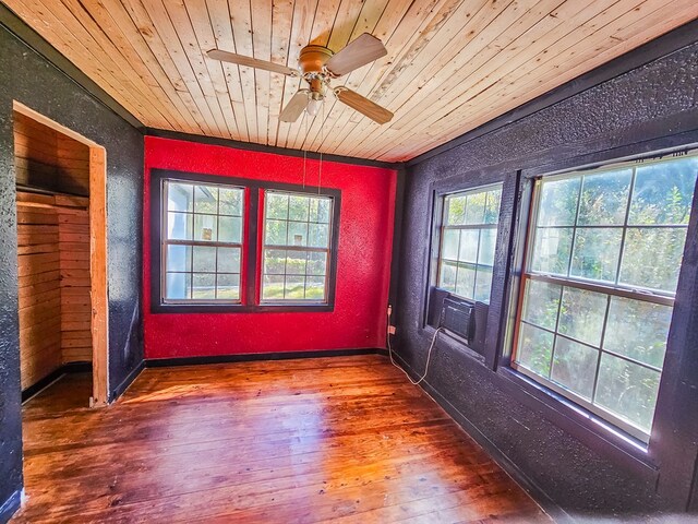 doorway to outside featuring ceiling fan, cooling unit, wood-type flooring, and wooden ceiling