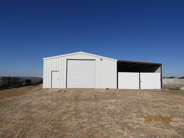 view of outbuilding featuring a garage