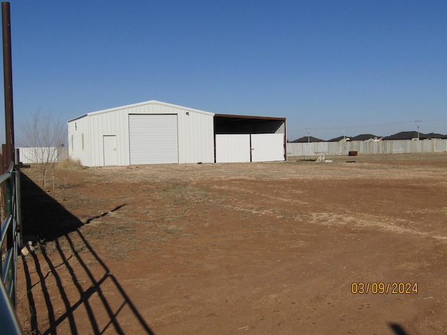 view of outdoor structure with a garage