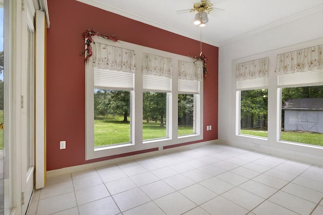 unfurnished sunroom with ceiling fan