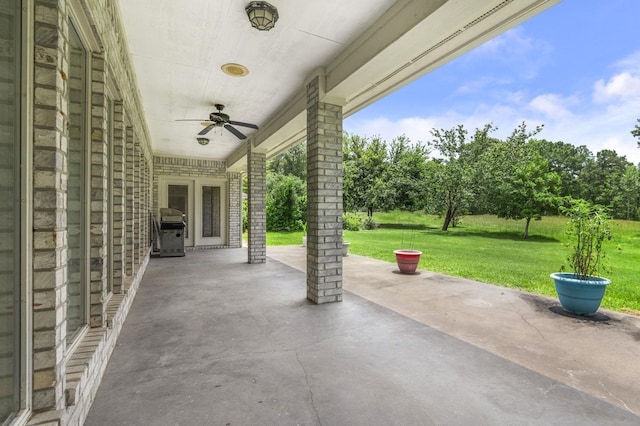 view of patio with ceiling fan and a grill