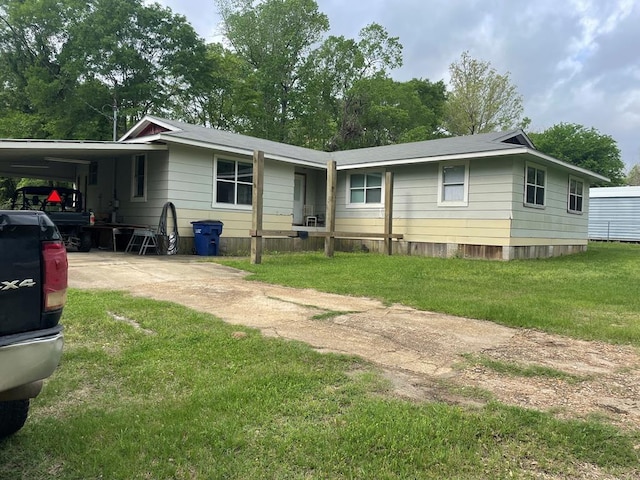149 County Road 355, Jasper, TX 75951 - view of front of property with driveway, an attached carport, and a front yard