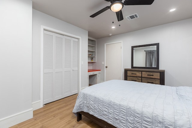 bedroom featuring ceiling fan, a closet, and light hardwood / wood-style flooring